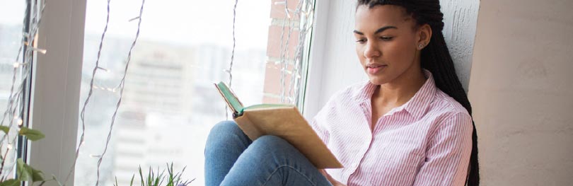 Teenage girl reading a book