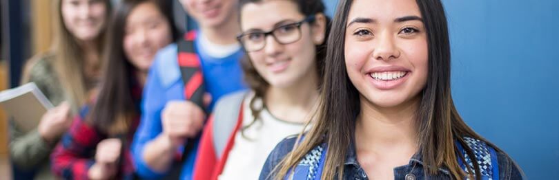 Teens smiling at the camera