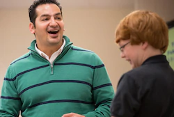 Two young men laughing