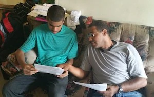 Hector Terrero talking with his father.